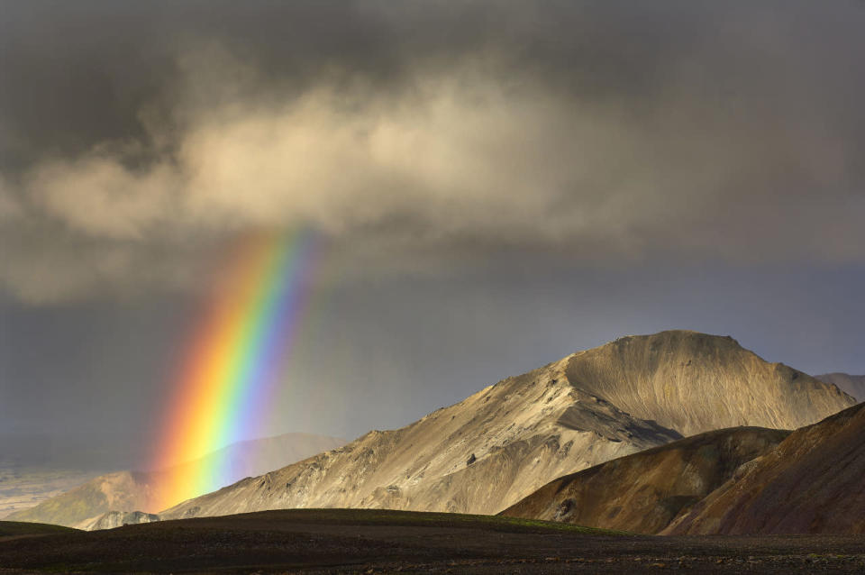 A landscape view of a rainbow appearing on Iceland’s Laugavegur trek. (Michael Fersch/Caters News Agency)