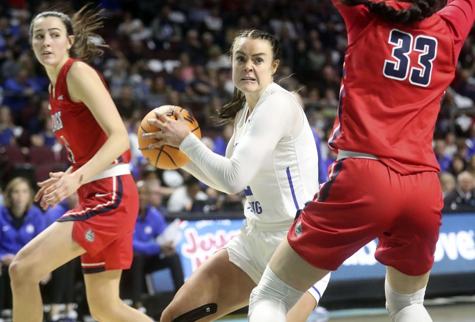 BYU forward Lauren Gustin grabs the ball during a game against Gonzaga at the Orleans Arena in Las Vegas on March 8, 2022.