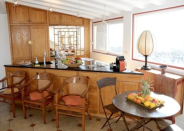 <p>The large, open-concent kitchen and living room are upstairs. (Airbnb) </p>