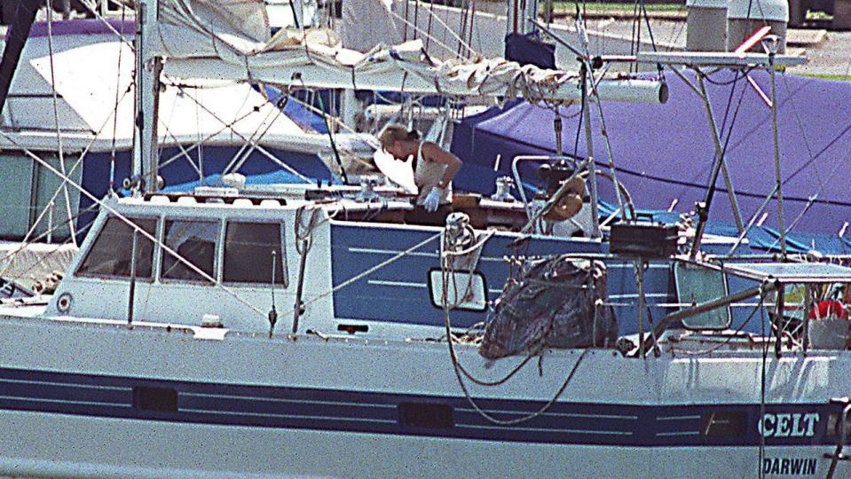 OCTOBER, 2001 : Forensic officer aboard yacht The Celt moored in Cullen Bay, Darwin 10/01 after Avril Croft & daughter Alahna strangled & shot by Avril's boyfriend Garry Douglas Whitsed.\nCrime / Murder / Shooting\nYachting