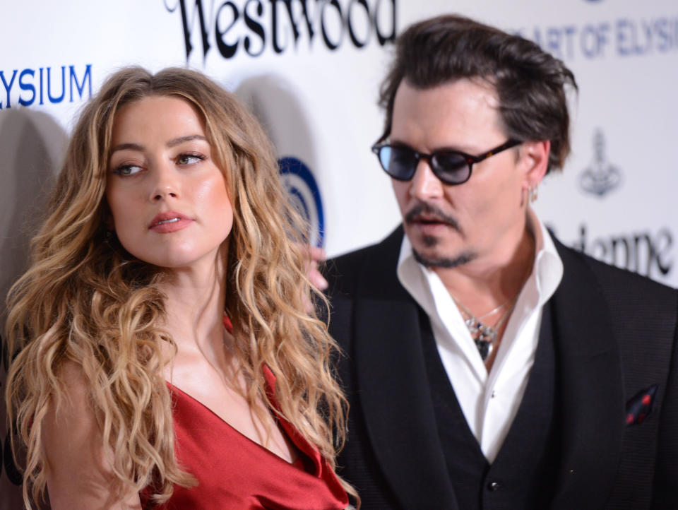 CULVER CITY, CA - JANUARY 09:  Amber Heard and Johnny Depp attend the Art of Elysium 2016 HEAVEN Gala presented by Vivienne Westwood & Andreas Kronthaler at 3LABS on January 9, 2016 in Culver City, California.  (Photo by C Flanigan/Getty Images)