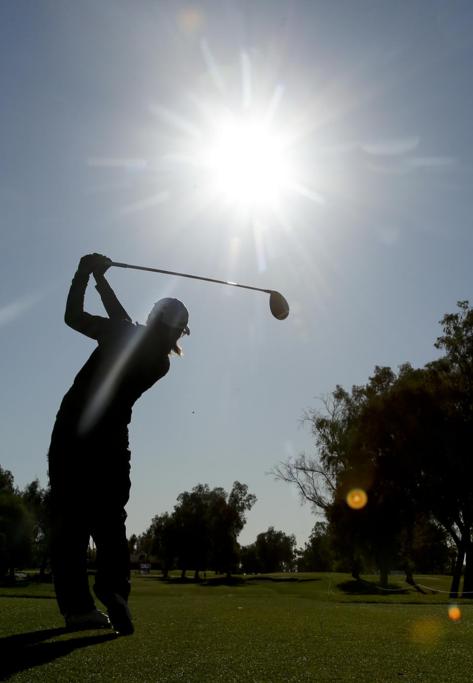 Lydia Ko, of New Zealand, watches her tee shot on the 12th hole during the first round at the LPGA Kraft Nabisco Championship golf tournament Thursday, April 3, 2014 in Rancho Mirage, Calif. (AP Photo/Chris Carlson)