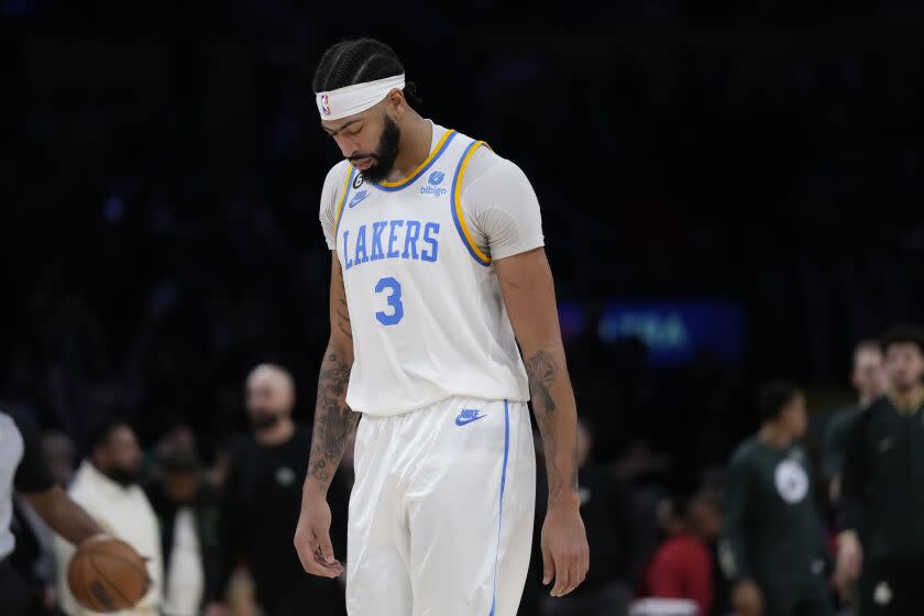 Los Angeles Lakers' Anthony Davis leaves the court after the team's 122-118 overtime loss to the Boston Celtics