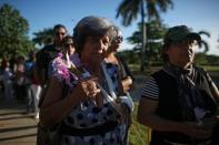 People stand in line to pay tribute to Cuba's late President Fidel Castro in Revolution Square in Havana, Cuba, November 28, 2016. REUTERS/Alexandre Meneghini