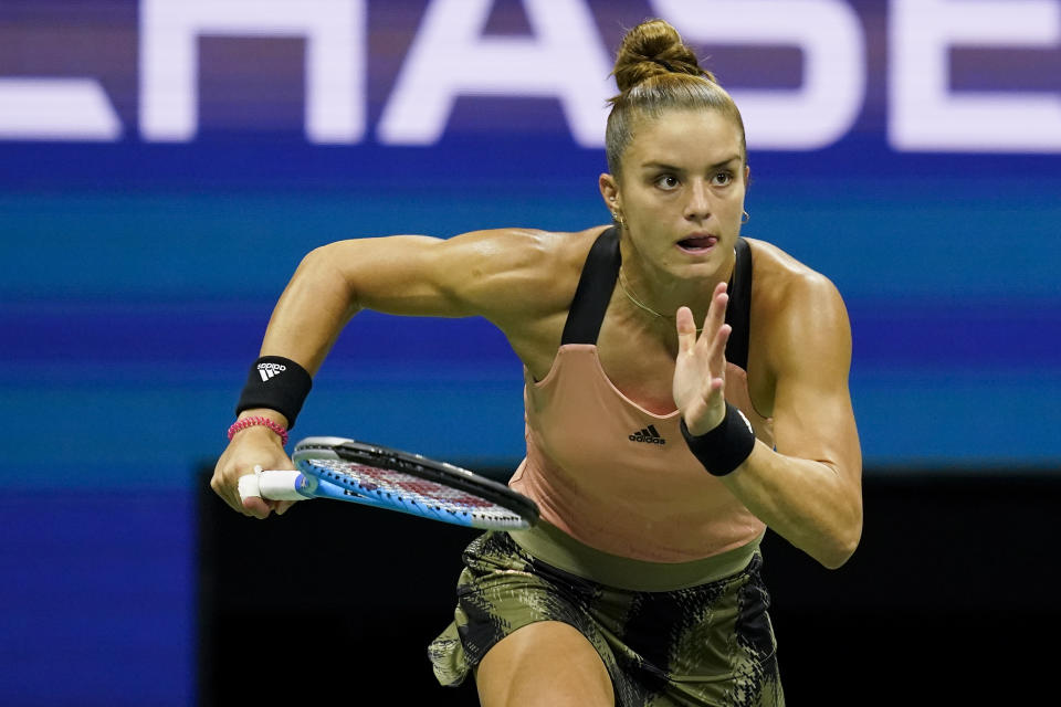 Maria Sakkari, of Greece, chases down a shot from Emma Raducanu, of Great Britain, during the semifinals of the US Open tennis championships, Thursday, Sept. 9, 2021, in New York. (AP Photo/Elise Amendola)