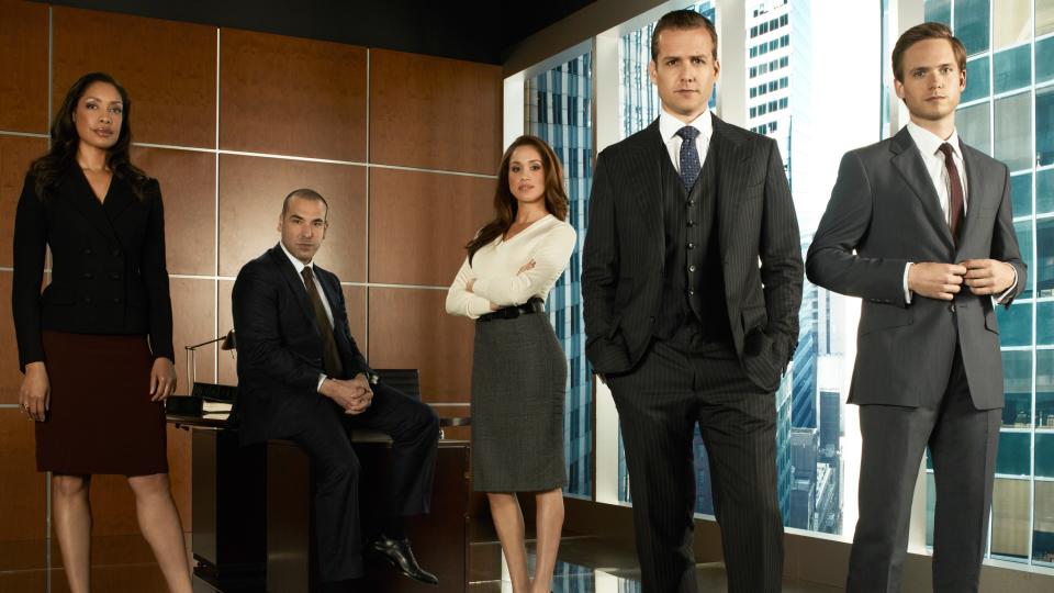 The main cast of Suits season 1, L-R: Jessica Pearson (Gina Torres), Louis Litt (Rick Hoffman), Rachel Zane (Meghan Markle), Harvey Specter (Gabriel Macht), and Mike Ross (Patrick J. Adams)