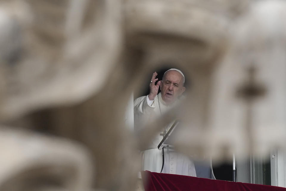 Pope Francis delivers his blessing during the Angelus noon prayer from the window of his studio overlooking St.Peter's Square, at the Vatican, Sunday, Oct. 3, 2021. (AP Photo/Alessandra Tarantino)