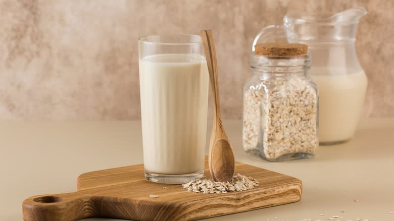 spoon balancing against oat milk glass 