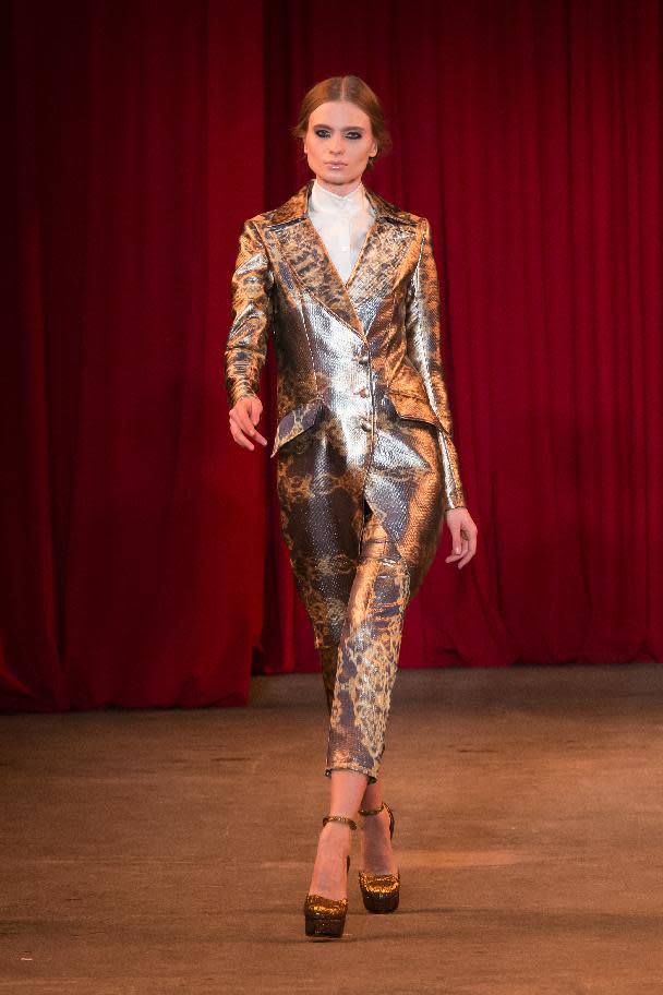 In this photo provided by Christian Siriano a model walks the runway during the Christian Siriano Fall 2013 fashion show during Fashion Week, Saturday, Feb. 9 2013, in New York. (AP Photo/Christian Siriano)