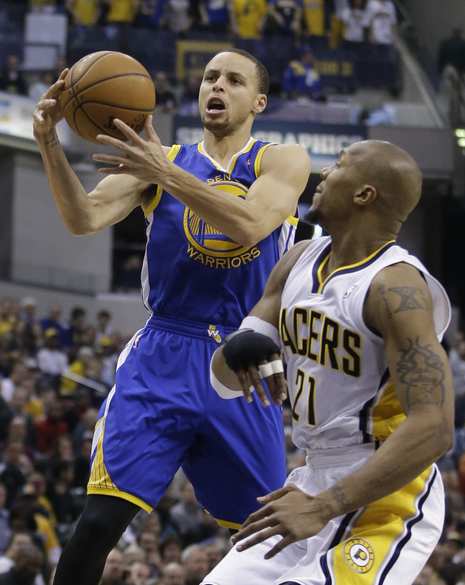 Golden State Warriors' Stephen Curry, left, shoots against Indiana Pacers' David West (21) during the first half of an NBA basketball game Tuesday, March 4, 2014, in Indianapolis. (AP Photo/Darron Cummings)
