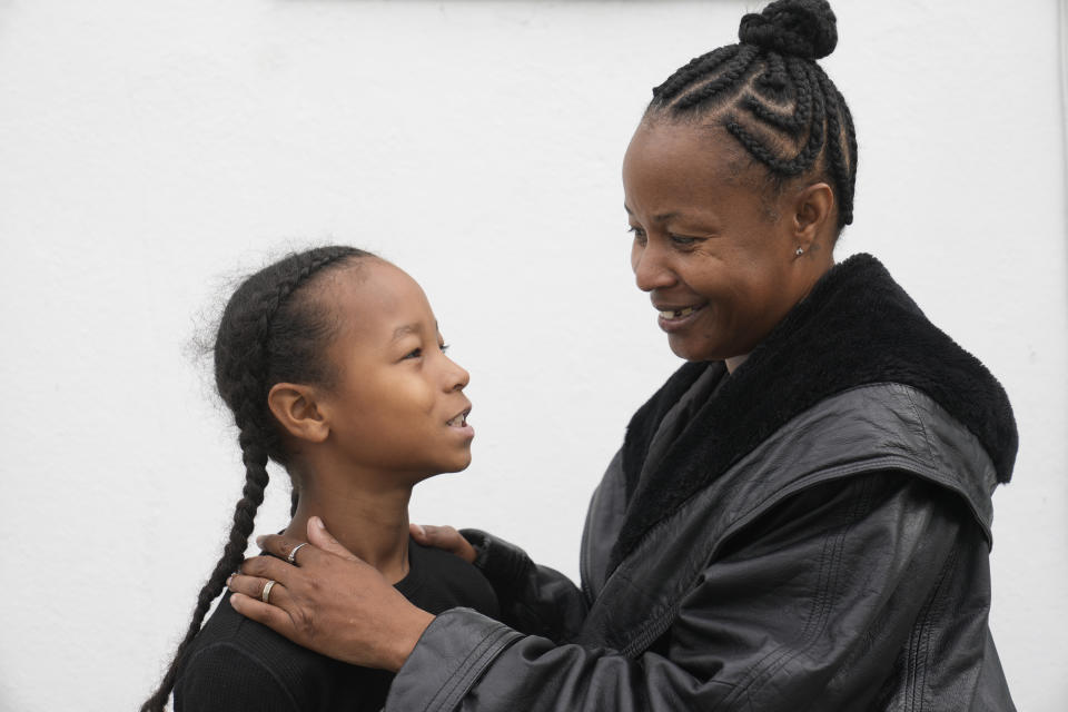 Miesha Clarke and her 10-year-old son, Ezekiel West, stand together for a portrait outside their home in Los Angeles on Sunday, Jan. 15, 2023. An administrative judge ruled that Los Angeles’ schools had violated Ezekiel’s rights and ordered the district to give him a spot at a new school, with a special plan to ease him back into learning and trusting teachers. The school didn’t follow the plan, so his mother stopped sending him in October. (AP Photo/Damian Dovarganes)