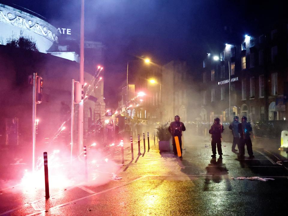 Fireworks were thrown at police officers in the riots in Dublin on Thursday (REUTERS)