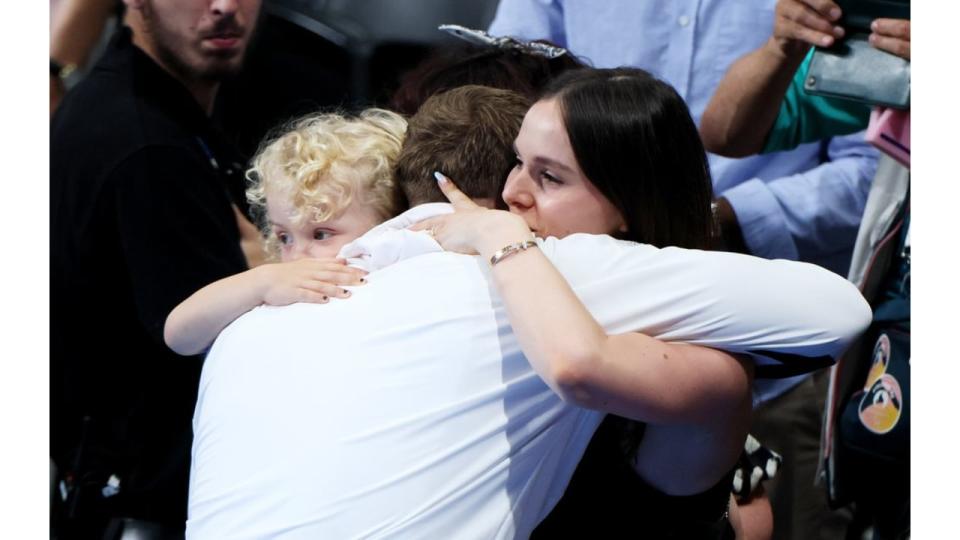 three people sharing hug 