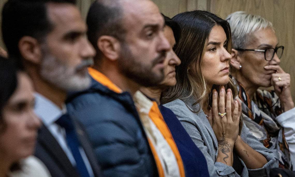 Miami, Florida, October 3, 2022 - Pablo Lyle’ wife, Ana Araujo, second from right, listens to arguments along with other family and relatives of Mr. Lyle in Miami Dade Criminal Court. Pablo Lyle is accused of killing 63-year-old Juan Ricardo Hernandez during a road rage incident in 2019.