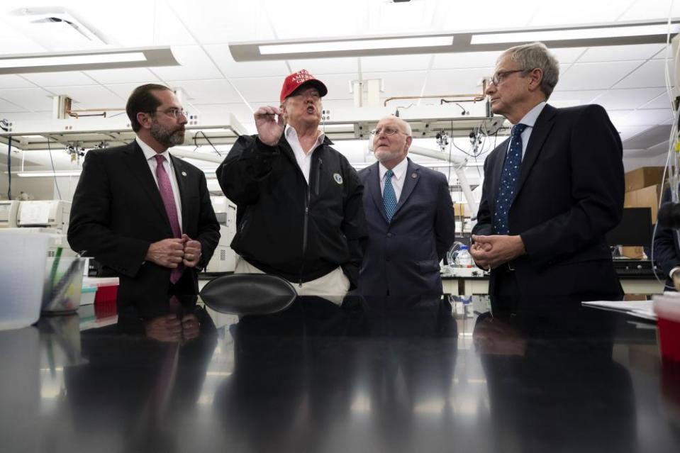 President Donald Trump speaks during a meeting with Health and Human Services Secretary Alex Azar, left, Centers for Disease Control and Prevention Director Robert Redfield, and Associate Director for Laboratory Science and Safety Steve Monroe, about the coronavirus at the Centers for Disease Control and Prevention, Friday, March 6, 2020 in Atlanta.