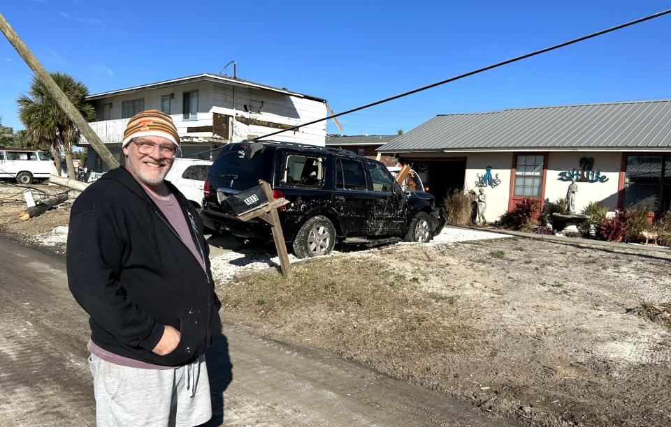Thomas Jacobs who lives on Treasure Circle survived the storm, however, his vehicles did not. Two of the vehicles in the driveway have pieces of someones roof sitting on them.