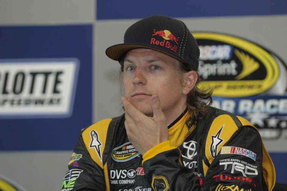 FILE - Kimi Raikkonen, of Finland, pauses during a news conference in Concord, N.C., May 20, 2011. Raikkonen will take a break from his retirement to return to racing this weekend in the NASCAR race at Watkins Glen. (AP Photo/Mike McCarn, File)