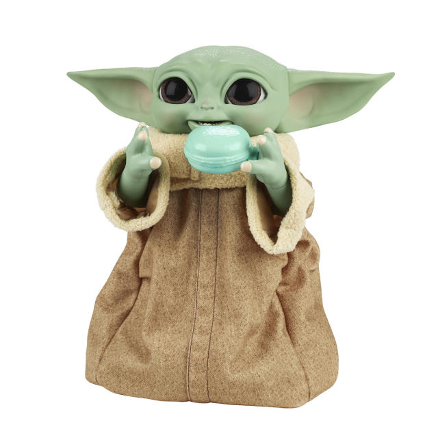 Premium Photo  Baby yoda with a blue background