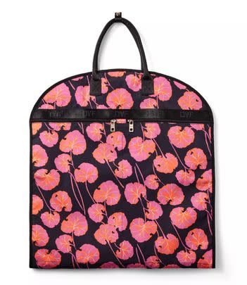 A pink geranium-print garment bag