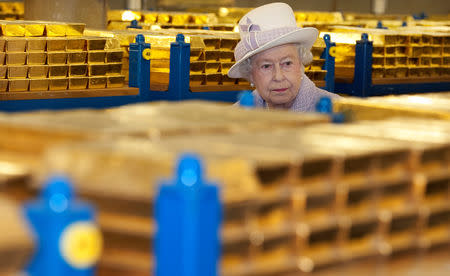 FILE PHOTO: Britain's Queen Elizabeth tours a gold vault during a visit to the Bank of England in the City of London December 13, 2012. REUTERS/Eddie Mulholland/Pool/File Photo
