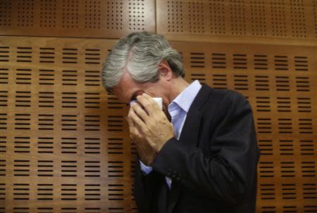 Adolfo Suarez Illana, son of Spain's first post Franco-era Prime Minister Adolfo Suarez, cries after announcing the imminent death of his father at a news conference in Madrid March 21, 2014. REUTERS/Andrea Comas