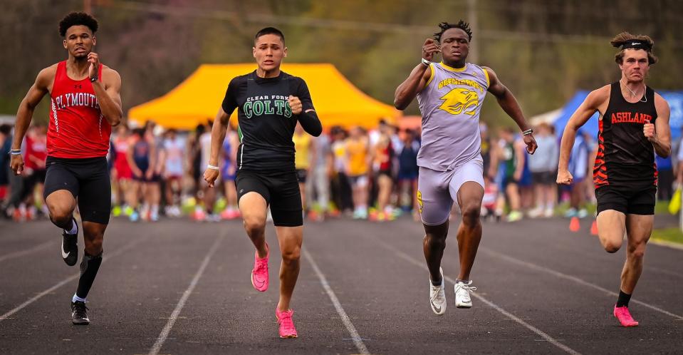 Clear Fork's Joe Stupka matches up with Plymouth's Caiden Allen (left) in the prelims of the 100 meters at the 90th Mehock Relays.