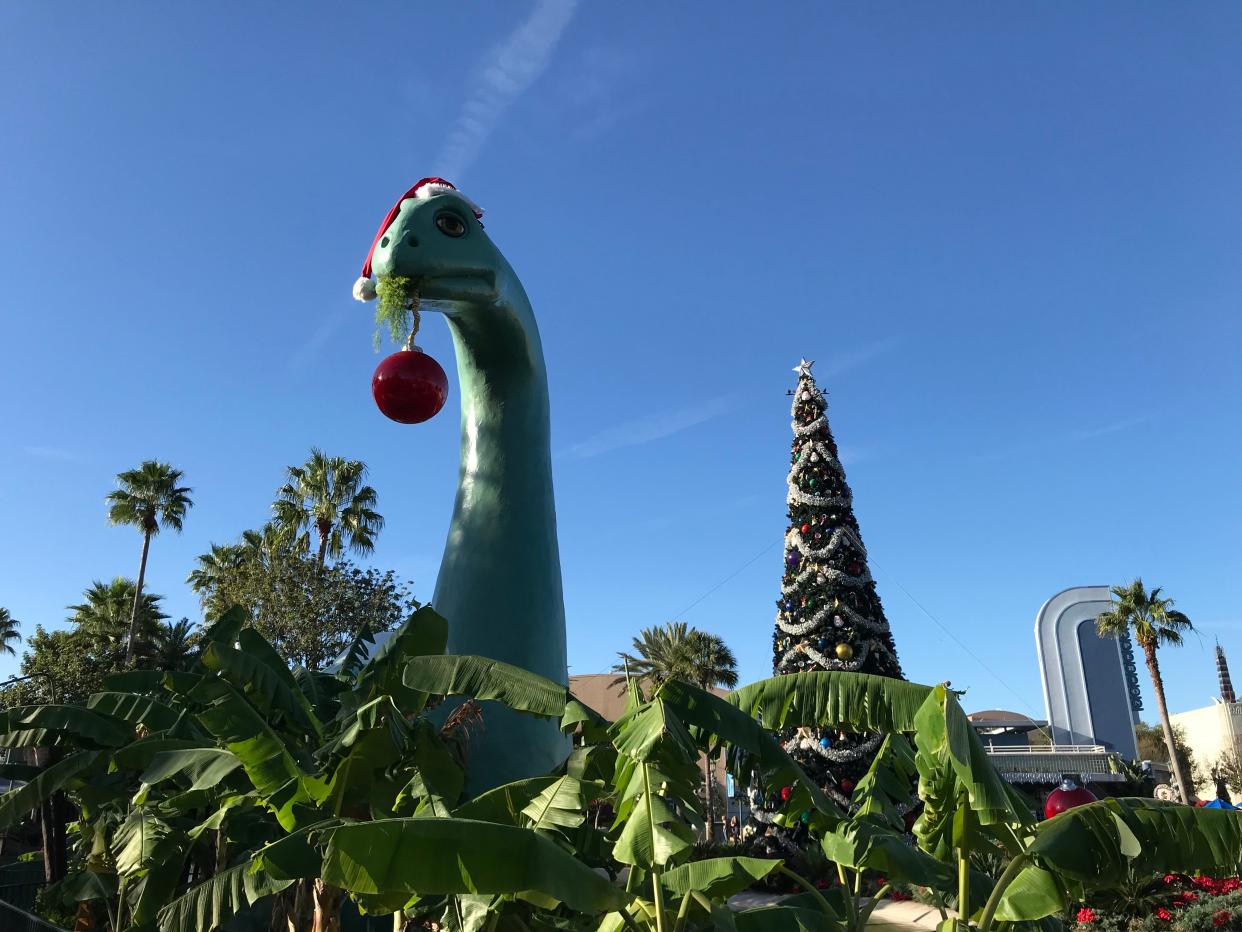 Gertie the dinosaur gets in the holiday spirit at Disney's Hollywood Studios.