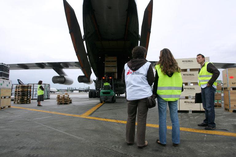 Medecins sans Frontieres (Doctors without Borders) NGO workers prepare to load a plane with humanitarian aid for Myanmar on Merignac airport, outside Bordeaux, France, on May 9, 2008