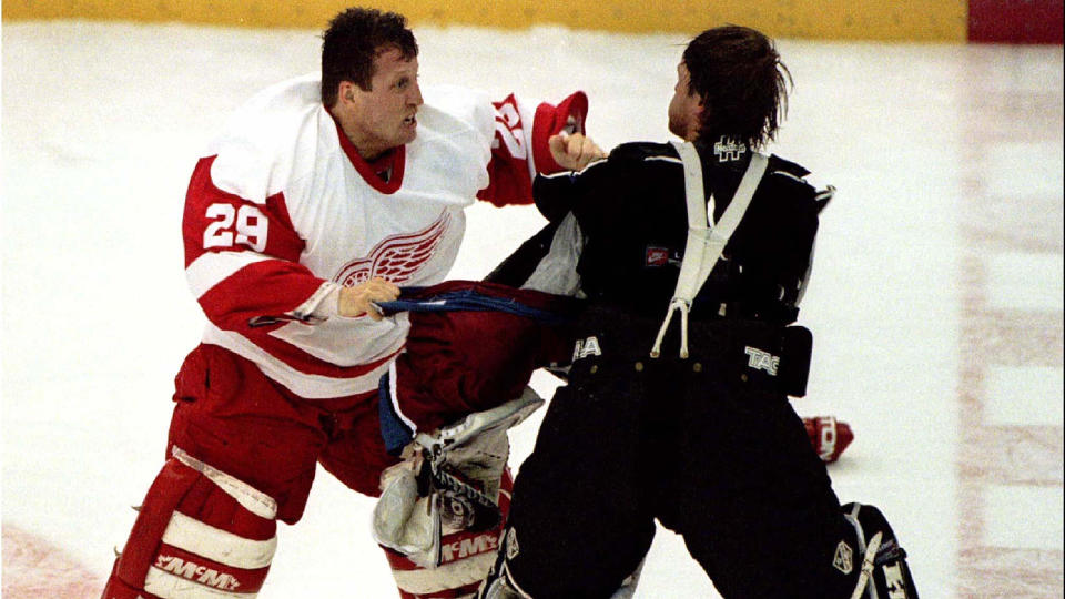 Mike Vernon, left, and Patrick Roy delivered one of the best goalie fights in NHL history. (Photo via Reuters)