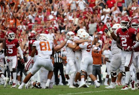 Oct 6, 2018; Dallas, TX, USA; Texas Longhorns place kicker Cameron Dicker (17) celebrates with teammates after kiccking the game-winning field goal during the fourth quarter against the Oklahoma Sooners at the Cotton Bowl. Kevin Jairaj-USA TODAY Sports