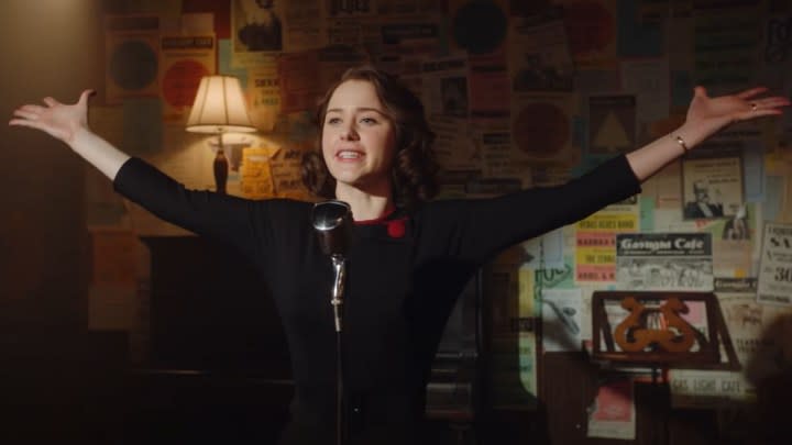 Rachel Brosnahan opens her arms onstage in The Marvelous Mrs. Maise.