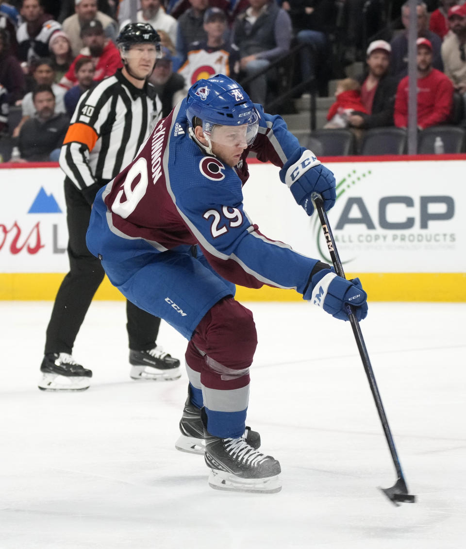 Colorado Avalanche center Nathan MacKinnon scores a goal against the Detroit Red Wings in the third period of an NHL hockey game Monday, Jan. 16, 2023, in Denver. (AP Photo/David Zalubowski)