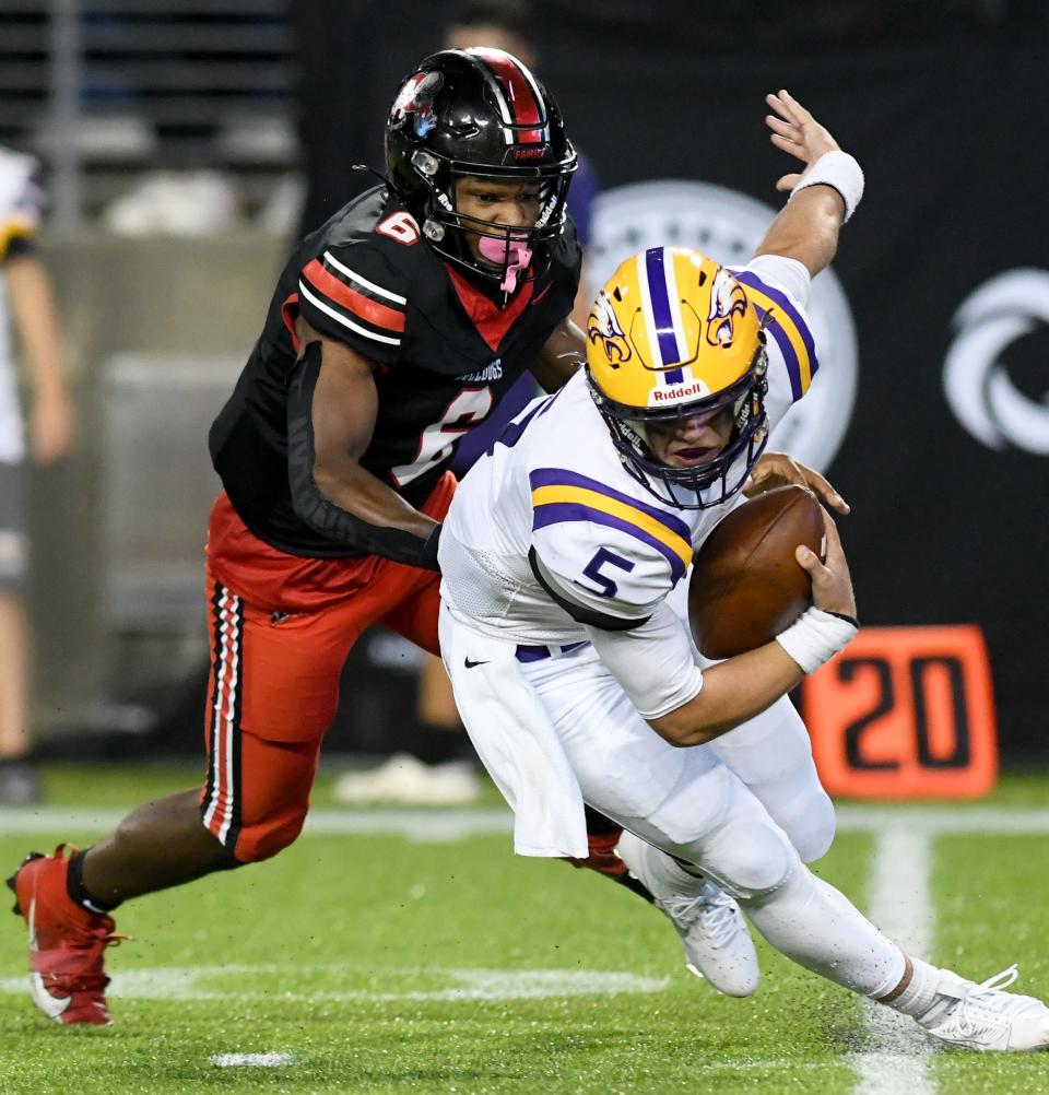 McKinley's Shaukeer Hatcher brings down Avon quarterback Nolan Good in the third quarter, Friday, Aug. 25, 2023.