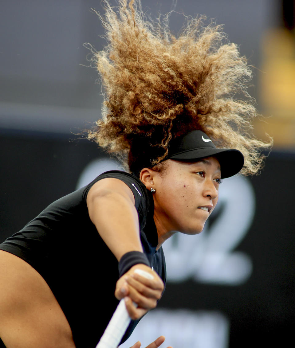 Japan's Naomi Osaka serves during her match against United States' Serena Williams at an exhibition tennis event in Adelaide, Australia, Friday, Jan 29. 2021. (Kelly Barnes/AAP Image via AP)