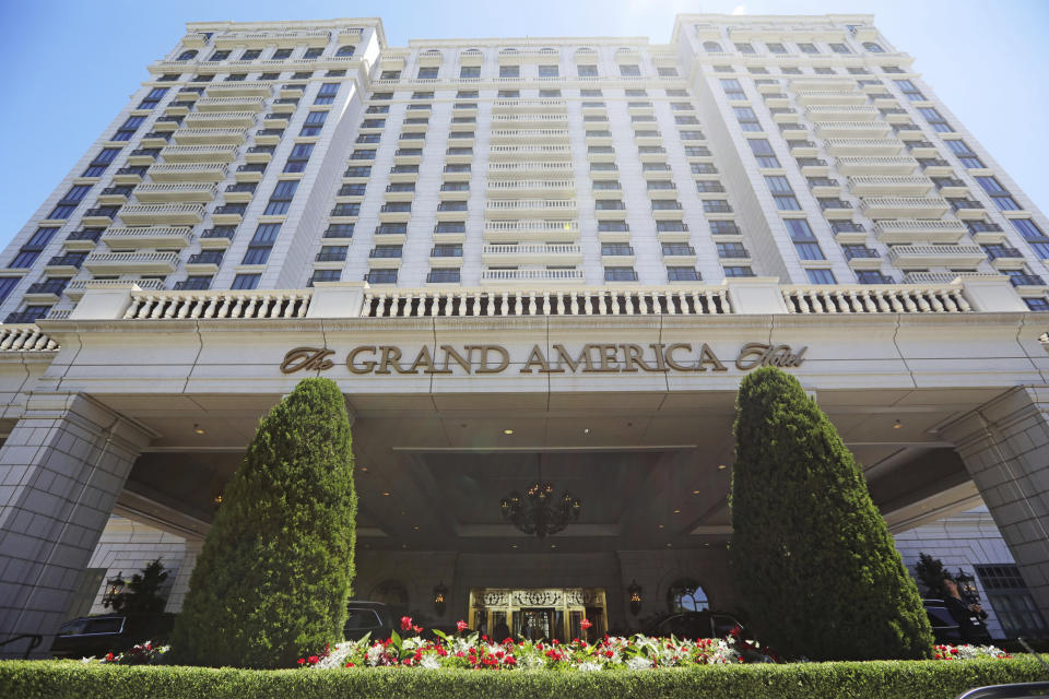 This Sunday, June 23, 2019, photo shows the Grand America Hotel, in Salt Lake City. A lawsuit filed Tuesday, accuses the luxury Grand America Hotel in Salt Lake City of luring workers from the Philippines to a program that promised training and cultural immersion but instead forced them to work long hours doing menial jobs for low pay. (AP Photo/Rick Bowmer)