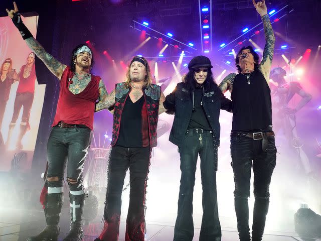 Kevin Mazur/Getty Nikki Sixx, Vince Neil, Mick Mars and Tommy Lee of Motley Crue on stage together in June 2022