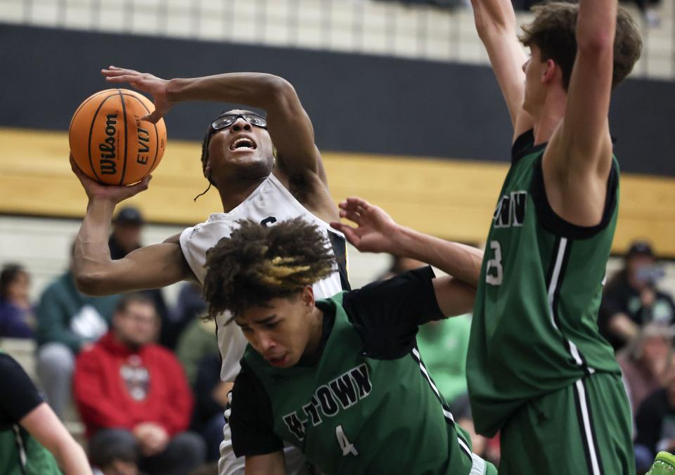 Cottonwood’s Peter Oguama prepares to shoot as Hillcrest’s Damani Wilkerson tries to stop him at Cottonwood High in Murray on Wednesday, Feb. 7, 2024. | Laura Seitz, Deseret News