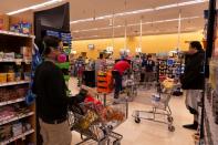 Instacart employee Eric Cohn works amid the coronavirus outbreak