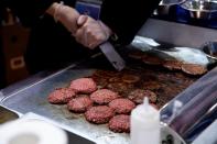 FILE PHOTO: A chef makes hamburgers out of plant-based meat by Impossible Foods at the second China International Import Expo (CIIE) in Shanghai