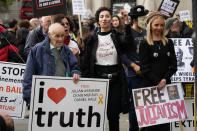 Supporters stage a demonstration outside the High Court in London, Wednesday, Oct. 27, 2021. The U.S. government is scheduled to ask Britain's High Court to overturn a judge's decision that WikiLeaks founder Julian Assange should not be sent to the United States to face espionage charges. A lower court judge refused extradition in January on health grounds, saying Assange was likely to kill himself if held under harsh U.S. prison conditions. (AP Photo/Frank Augstein)