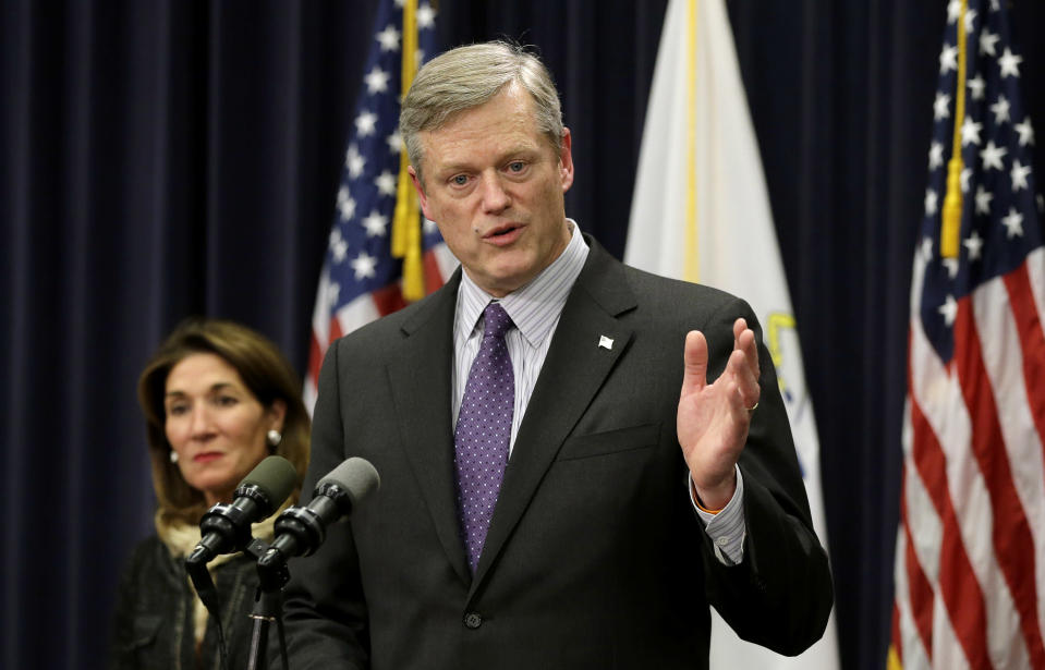 FILE — Massachusetts Republican Gov. Charlie Baker, right, faces reporters as Mass. Lt. Gov. Karyn Polito, left, looks on during a news conference at the Statehouse, Jan. 25, 2017, in Boston. Baker announced Wednesday, Dec. 1, 2021 that he won't seek a third term as governor of Massachusetts. (AP Photo/Steven Senne, File)