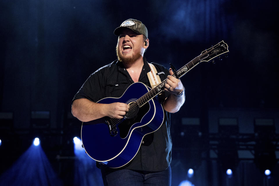 FILE - Luke Combs performs during CMA Fest 2022 in Nashville, Tenn., on June 11, 2022. Comb's latest album, "Growin' Up," releases Friday, July 1. (Photo by Amy Harris/Invision/AP, File)