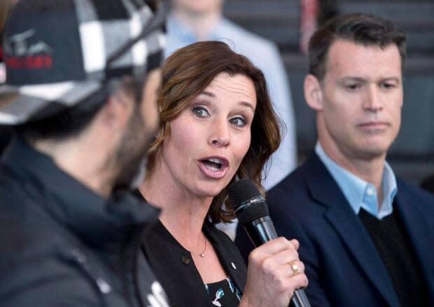 Former Olympic speed skater Catriona Le May Doan, centre, during a press conference about the Winter Olympic bid for 2026 in Calgary in 2018. (The Canadian Press/Larry MacDougal/File - image credit)