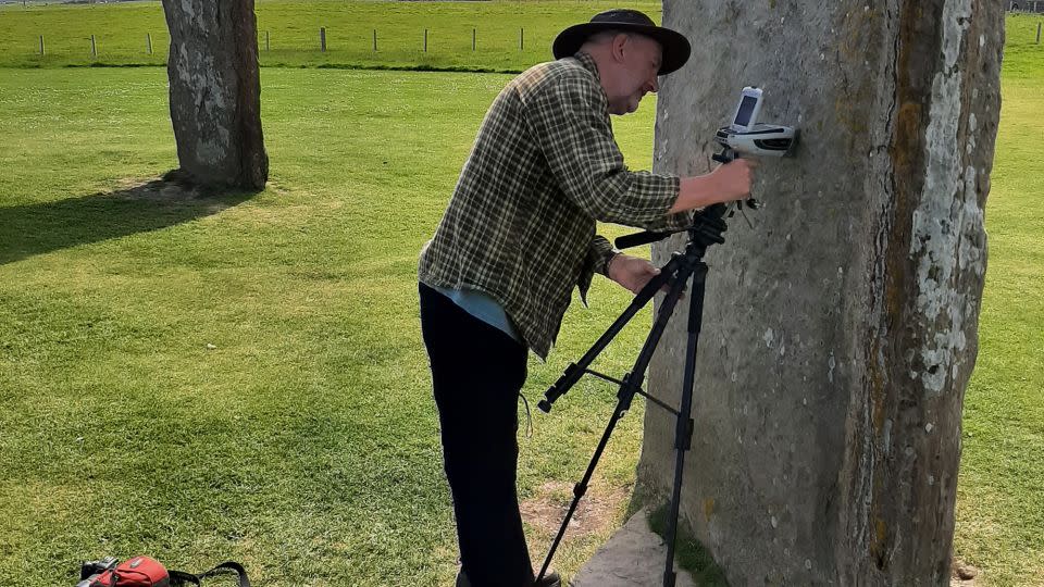 Study co-author Nick Pearce, professor of geography and earth sciences at the University of Aberystwyth, analyses Neolithic rocks in Orkney, an archipelago off the northeast coast of Scotland. - Richard Bevins/Aberystwyth University