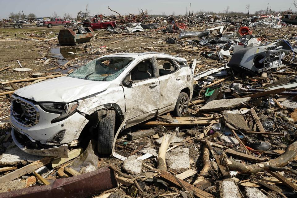 A vehicle awaits removal Saturday March 25, 2023, after getting destroyed by a Friday night tornado that hit Rolling Fork, Miss. Emergency officials in Mississippi say several people have been killed by tornadoes that tore through the state on Friday night, destroying buildings and knocking out power as severe weather produced hail the size of golf balls moved through several southern states. (AP Photo/Rogelio V. Solis)