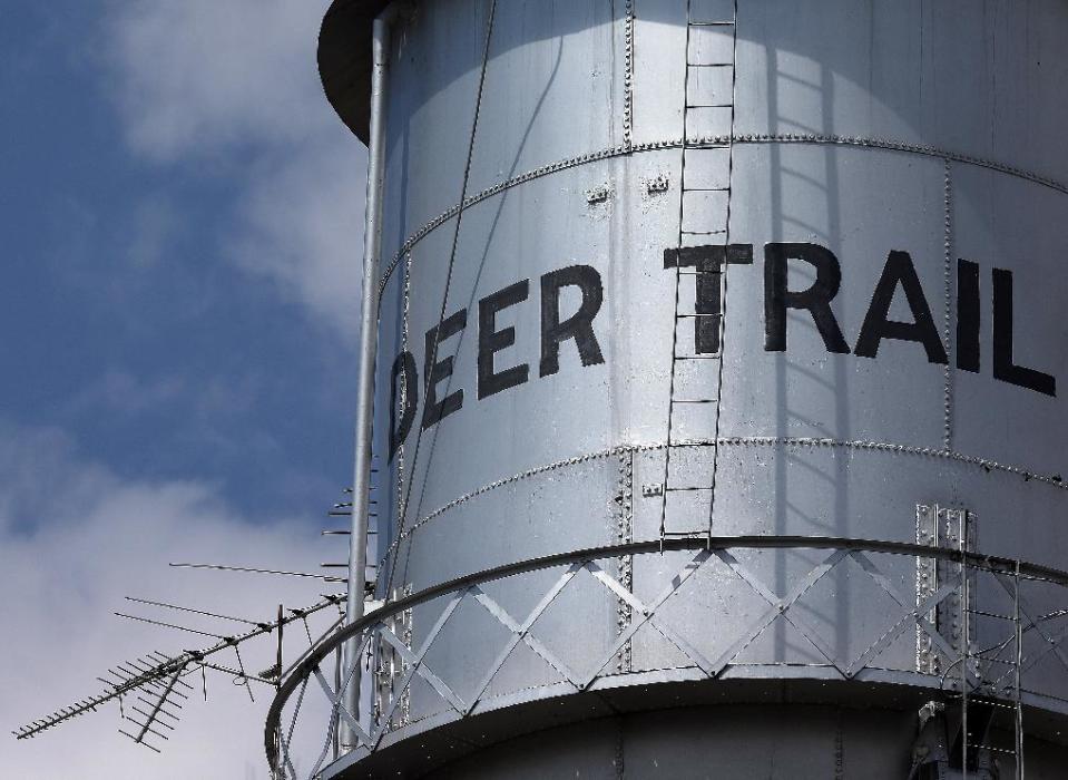 File - This Thursday Aug. 22, 2013 file photo shows the local water tower in Deer Trail, Colo., population 500. This rural town an hour east of Denver that calls itself home of the world’s first rodeo has an unusual special election happening on April 1, 2014: Should the city issue hunting licenses to shoot down unmanned aerial drones? (AP Photo/Brennan Linsley, file)