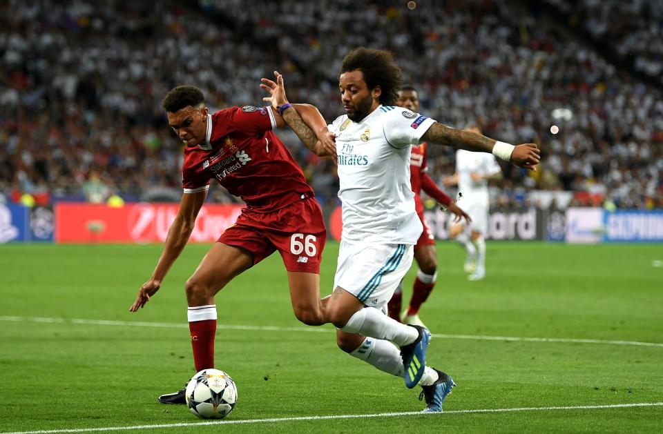 <p>Marcelo battles with Liverpool’s Trent Alexander-Arnold </p>