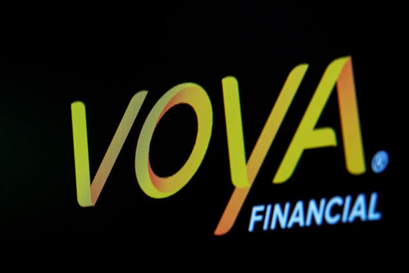 The Voya Financial Inc. logo is displayed on a screen on the floor of the NYSE in New York