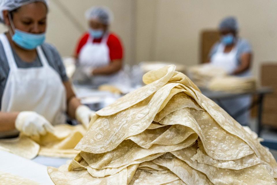 Employees packs tortillaat La Sonorense Tortilla Factory in Phoenix, Az. The Hernandez family has operated La Sonorense Tortilla Bakery in south Phoenix for more than 30 years. They have since expanded with two more locations -- a pan dulce bakery and a large tortilla factory, although they will consolidate soon. La Sonorense makes a hundred deliveries a day of flour and corn tortillas to Arizona restaurants. They also serve as a neighborhood tortilla shop for families in south Phoenix.