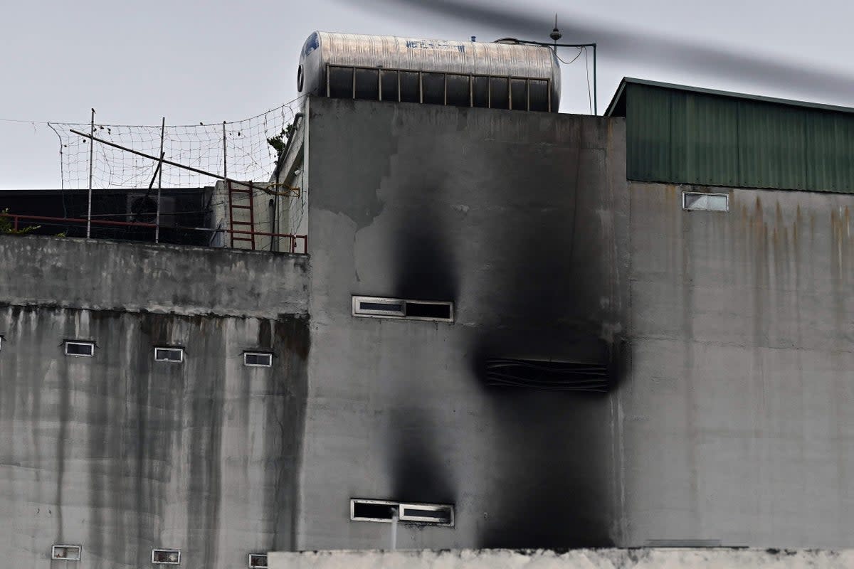 Smoke damage is pictured on the wall of an apartment block after a major fire in Hanoi on 13 September (AFP via Getty Images)